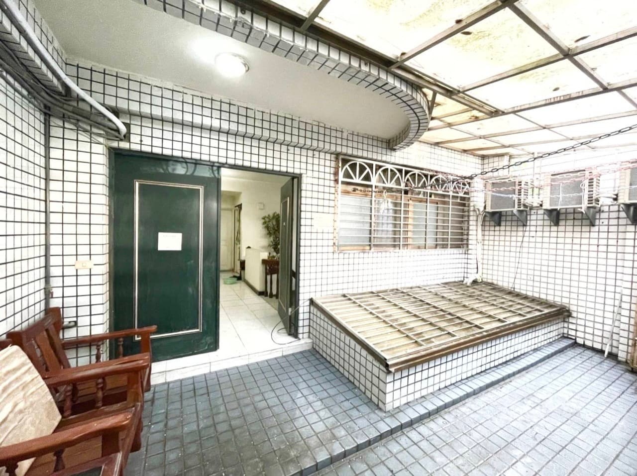 Covered patio at the ground-floor entrance of the home
