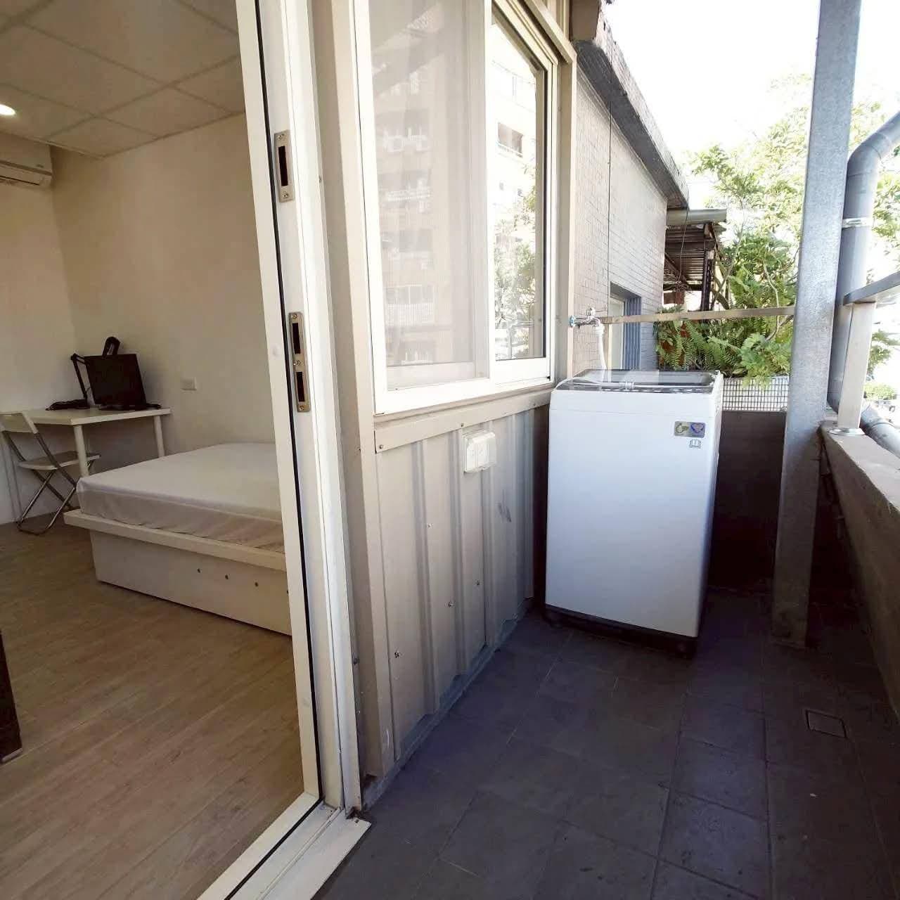 Balcony with washing machine outside the room